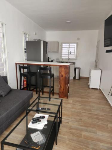 a living room with a couch and a table at Residencias crasky in Punta Cana