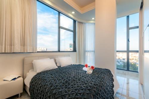 a bedroom with a bed with two teddy bears on it at Apartment Magical View in Jerusalem