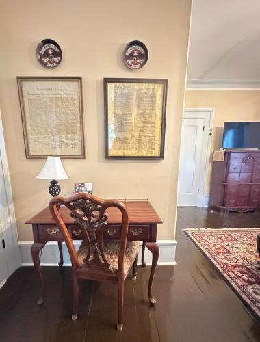 a room with a desk with a lamp and a chair at Belmont Inn in Shelbyville