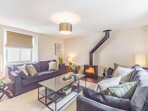 a living room with two couches and a fireplace at No 2 Ness Street in Berwick-Upon-Tweed