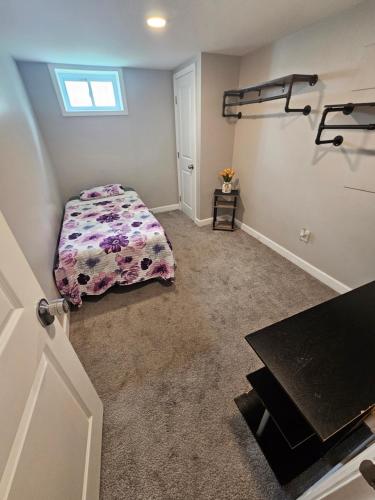 a bedroom with a bed and a table in it at Welcome in Woodlawn