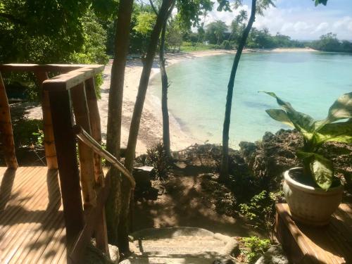 a view of the beach from the porch of a house at Camotes Cay Hideaway in San Francisco