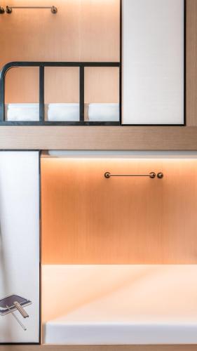 a wooden cabinet with two drawers in a room at Zunjing Boutique Hotel Nanjing Confucius Temple in Nanjing
