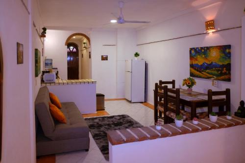 a living room with a couch and a table at Balcony GrandiaHouse in Puerto Vallarta