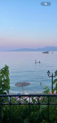 two people in the water in the ocean at Studios on the beach in Galaxidi
