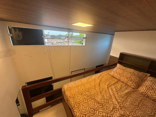 Postel nebo postele na pokoji v ubytování 03 Kitnet próximo da praia com ar-condicionado