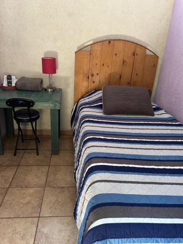Postel nebo postele na pokoji v ubytování Pension Baja Paradise