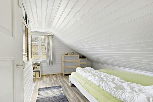 a bedroom with two beds and a window at Traditional House With Personal Decor in Hauge