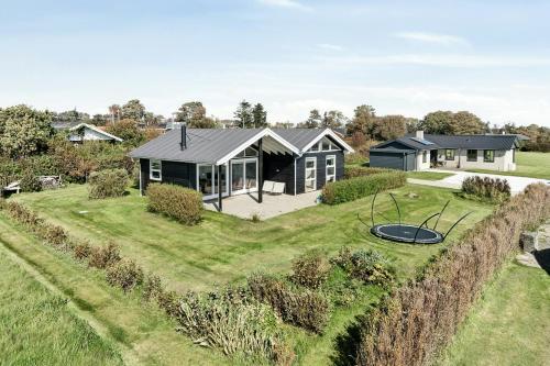 an aerial view of a house with a yard at Cozy Home By Limfjord With Bathing Jetty in Snedsted