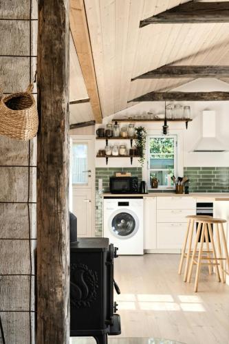 a kitchen with a stove in a room at Peace Of Mind And A Smile On Your Lips At Havnsø in Føllenslev