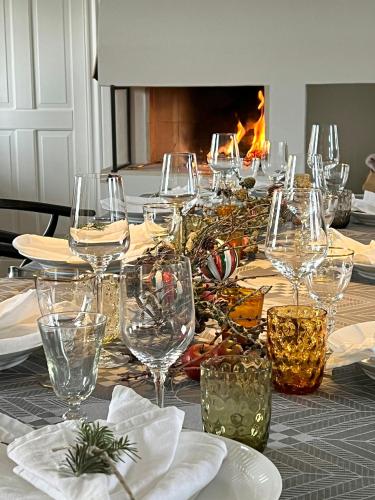 a table with wine glasses on top of it at Aesthetic Rural Idyll In East Funen in Nyborg