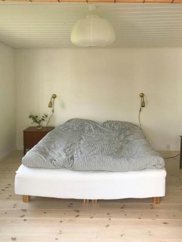Ένα ή περισσότερα κρεβάτια σε δωμάτιο στο Nordic Haven For Families At Guest Houses