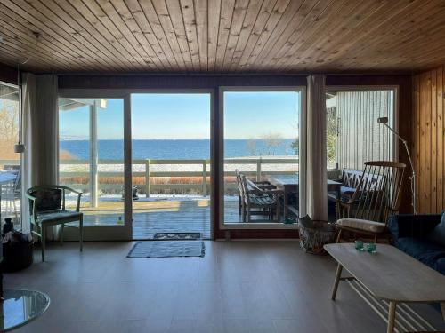 a living room with a view of the ocean at Holiday Home With Fjord Views By Isefjord in Nykøbing Sjælland