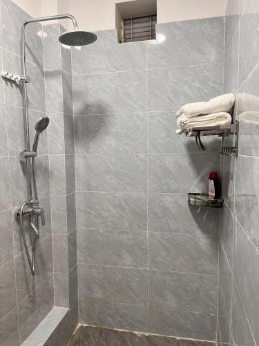 a shower with a glass door in a bathroom at The City escape Sabaki green estate - 15 minutes to JKIA and SGR in Marimbeti