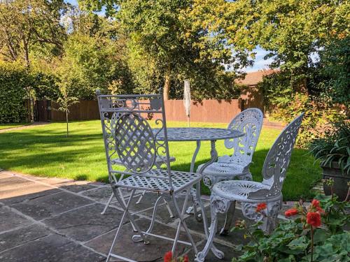 a table and two chairs and a table and a table and chairs at The Beaches in Stalham
