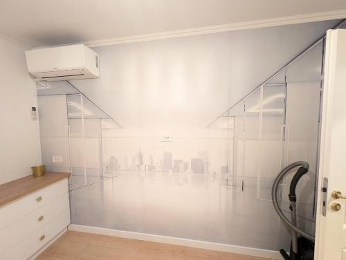 a white room with a view of the city at Imedio Coral Apartment Aviatiei in Bucharest