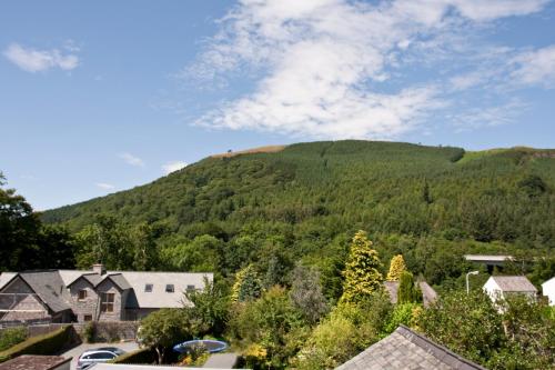 a green hill in the middle of a village at Brookfield B&B Guest House in Keswick