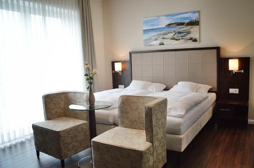 Postel nebo postele na pokoji v ubytování Hotel Drei Linden