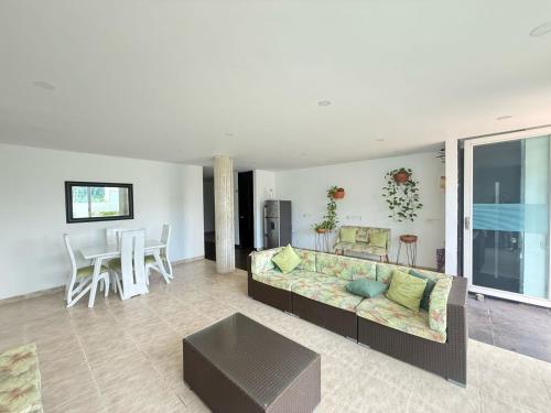 a living room with a couch and a table at Brisa del Mar in Cartagena de Indias