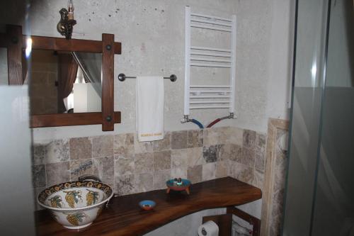 a bathroom with a sink and a bowl on a counter at Kemerli House in Avanos