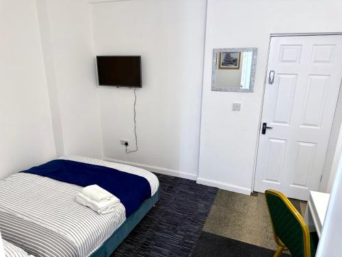 Postel nebo postele na pokoji v ubytování O5 Property