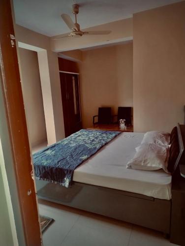 a bedroom with a large bed with a ceiling at Nature View Home Stay in Mandi