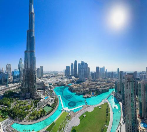 a view of the dubai skyline with the worlds tallest building at GRANDE RESIDENCES with a direct Burj Khalifa view and Private Fountain Show at 38th floor with DXB AIRPORT VIP Shuttle in Dubai