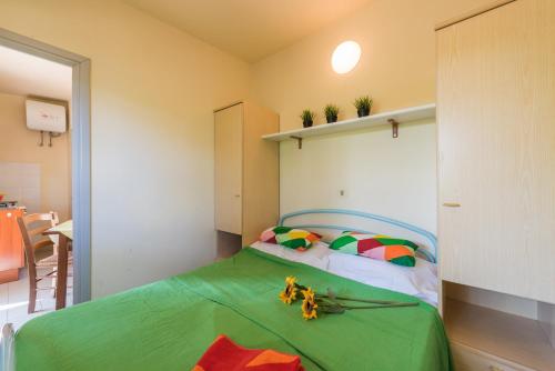 Postel nebo postele na pokoji v ubytování Camping Village Il Poggetto