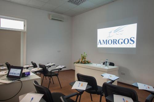 an office with desks and chairs with laptops on them at Amorgos Boutique Hotel in Larnaka