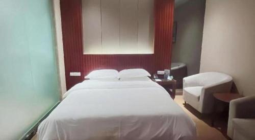 Katil atau katil-katil dalam bilik di Santavan Hotel Shenzhen Guangming