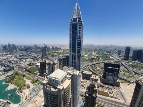 an aerial view of a city with a tall skyscraper at New Renovated Stylish 1 Br Dubai View 73 Floor in Dubai
