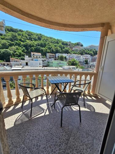 a table and chairs on a balcony with a view at Apartments Duga Ulcinj in Ulcinj