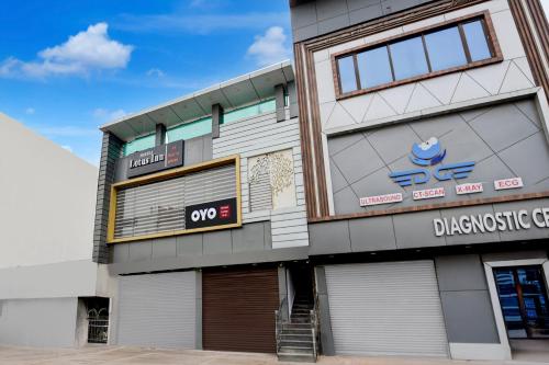 a building with white doors and signs on it at Hotel O Lotus Inn in Faridabad