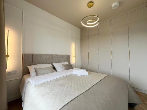Ένα ή περισσότερα κρεβάτια σε δωμάτιο στο Apartament Premium Przy Plaży Perłowa Przystań