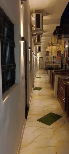 an empty hallway of a building with a hallwayngth at A G GEST HOUSE RAM MANDIR 500 Meetar in Ayodhya