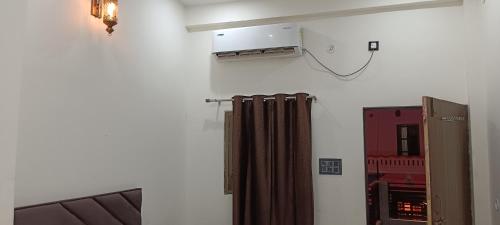 a room with a radiator and a fire truck at A G GEST HOUSE RAM MANDIR 500 Meetar in Ayodhya