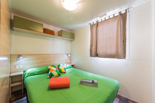 Postel nebo postele na pokoji v ubytování Camping Village Il Poggetto