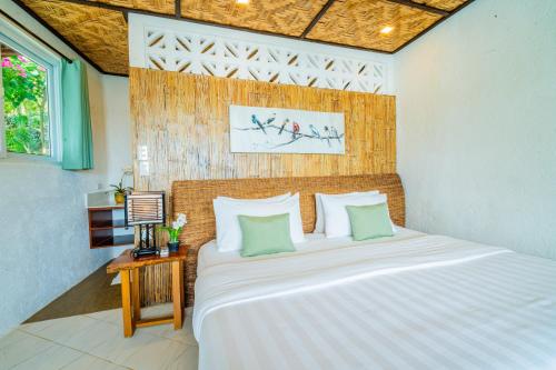 Ένα ή περισσότερα κρεβάτια σε δωμάτιο στο Pearl Bay Villas Private Resort
