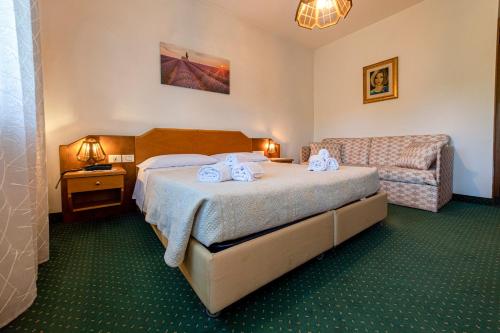Postel nebo postele na pokoji v ubytování Hotel Ristorante Sagittario