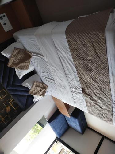 Ένα ή περισσότερα κρεβάτια σε δωμάτιο στο Hotel Reach & Rest