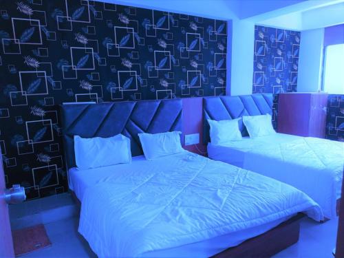 Ένα ή περισσότερα κρεβάτια σε δωμάτιο στο Hotel Reach & Rest