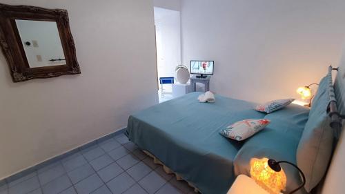 Postel nebo postele na pokoji v ubytování Hotel La Scogliera