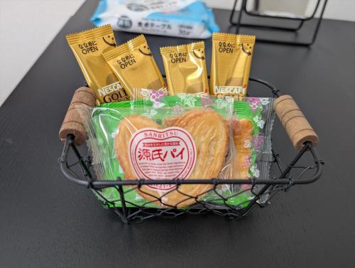 a basket of bread and pastries on a table at MerisuKabukicho,Tokyo in Tokyo