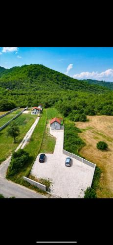 an aerial view of a parking lot with two cars at Sunset Dream Home Konjic in Konjic