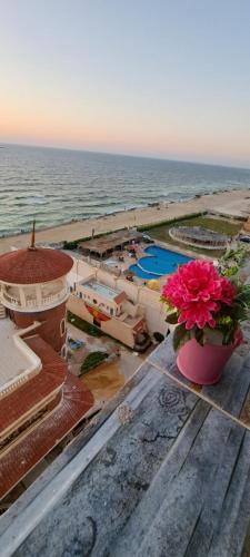 a view of the ocean from the roof of a building at Panorama Apartment with a charming sea view near Alexandria and Burg ElArab Airport with Free Wifi شقة باطلالة ساحرة على البحر اول الساحل الشمالي واي فاي مجاني迷人海景公寓 免费无线网络 in Alexandria