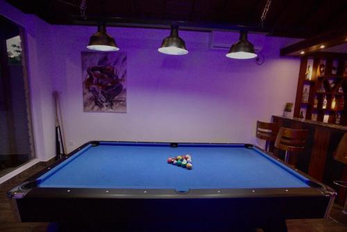 a pool table in a room with purple at Blue Villa Wadduwa in Wadduwa