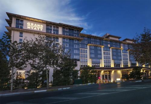 a large building with a sign that reads grand await at Grand Hyatt Istanbul in Istanbul