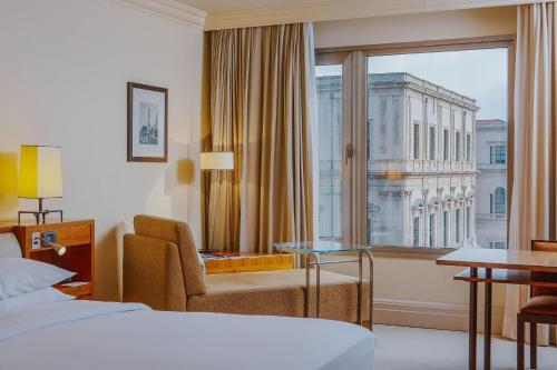 a hotel room with a bed and a window at Grand Hyatt Istanbul in Istanbul