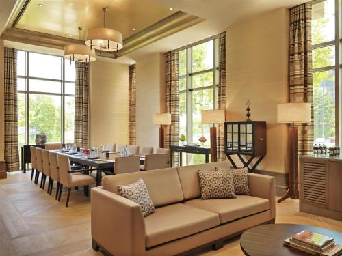 a living room with a couch and a dining room at Grand Hyatt Istanbul in Istanbul