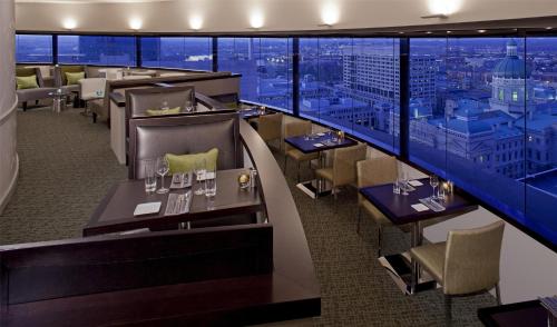 a restaurant with a view of a city at Hyatt Regency Indianapolis at State Capitol in Indianapolis
